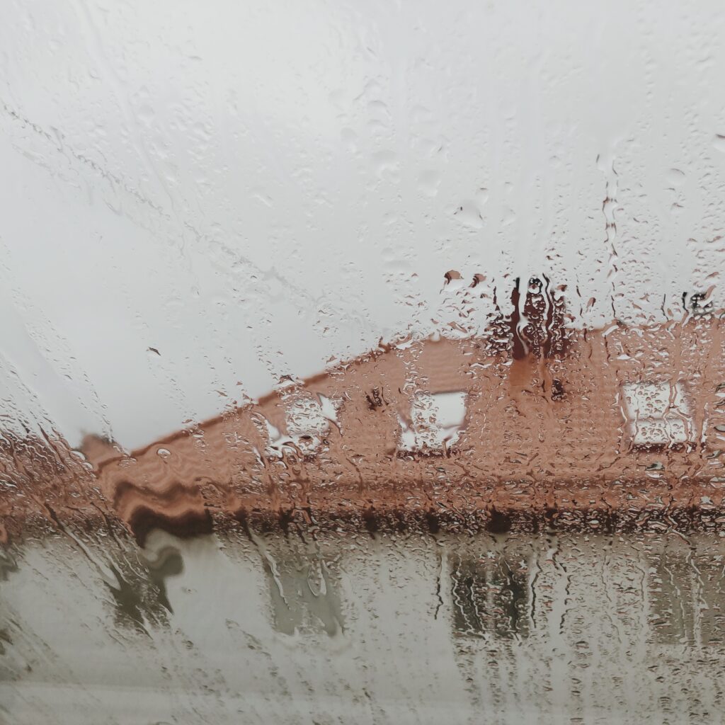 Loneliness Living Alone - Rain drops on loft apartment window